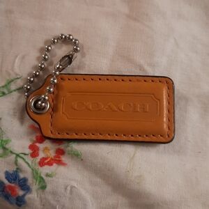 Coach Caramel or mustard tan colored tag